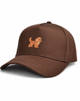 Side angle of The Goldendoodle Brown Hat showing the embroidered goldendoodle and curved brim