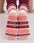 Non-slip soles of raspberry cream grip socks with silicone grip dots and almla logo