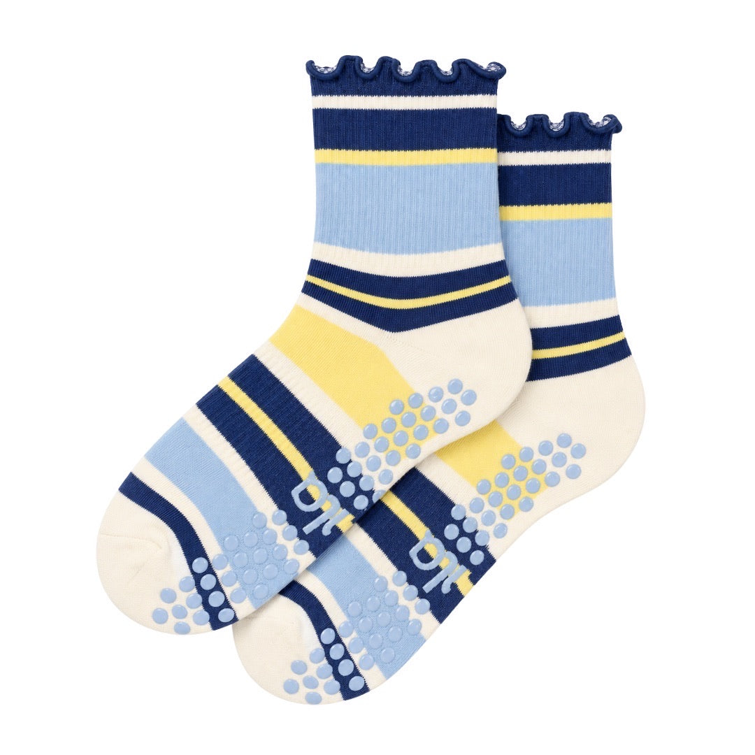Blueberry lemon striped grip socks in navy, blue and yellow with ruffle cuff and grip sole