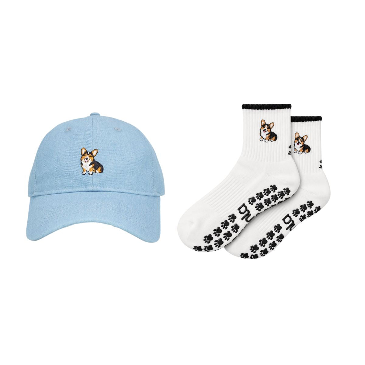 The Tri-Color Corgi Set, a washed denim corgi hat with matching oat milk Tri-Color Corgi grip socks with black paw print grips