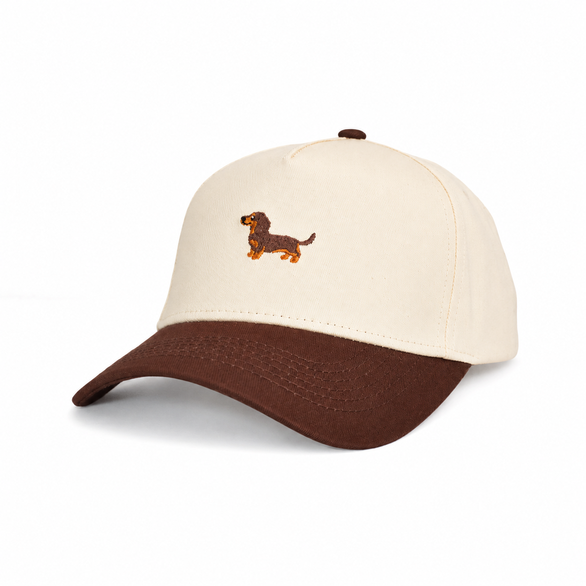 Side angle of The Doxie Brown Hat showing the embroidered dachshund and curved brown brim