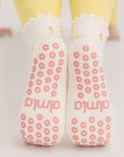 Non-slip soles of flower grip socks with pink flower-shaped grips and almla logo