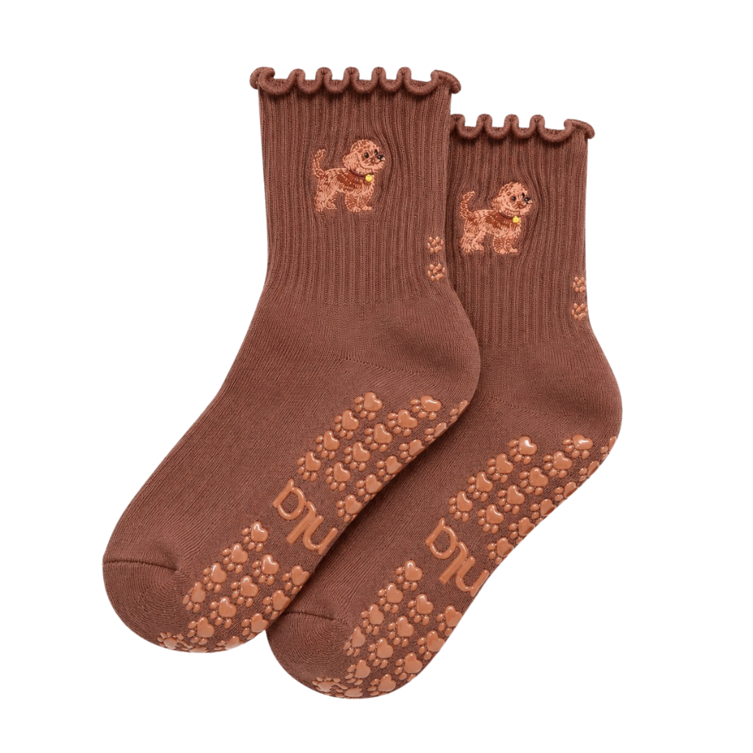The Doodle Grip Sock in espresso brown with embroidered golden doodle, ruffle cuff, and paw-shaped non-slip grips, laid flat on a white background